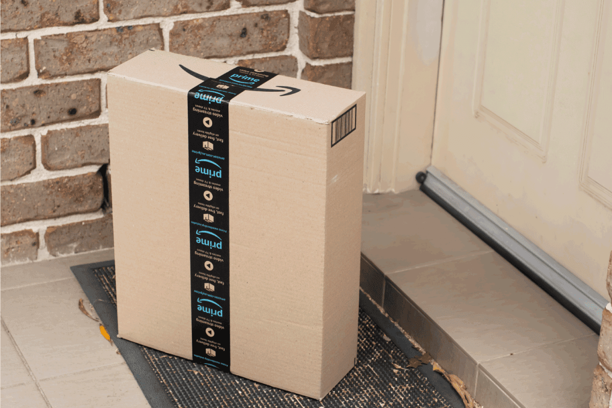 Amazon prime box delivered to a front door of residential building