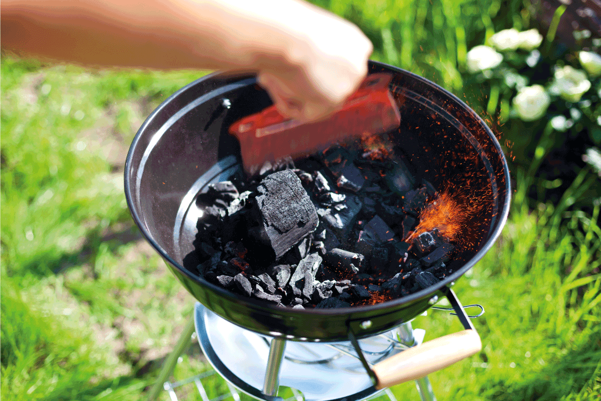 Barbecue charcoal in fire, preparing for grilling. How Long Does Charcoal Last In Storage