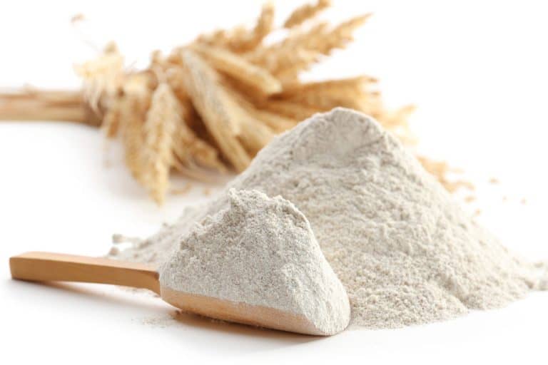 Heap of flour with wooden spoon and ears isolated on white, Can You Store Flour In Mylar Bags?