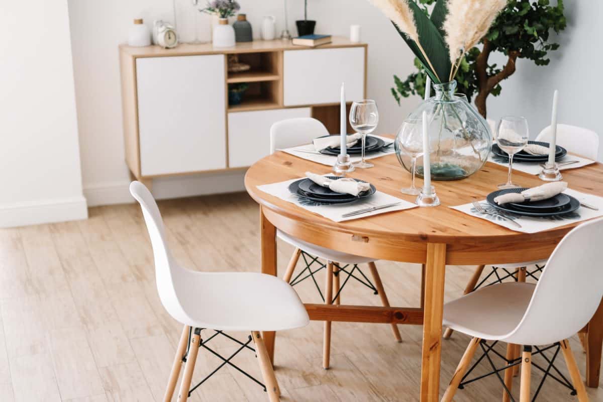 Served dining table in a modern Scandinavian kitchen.

