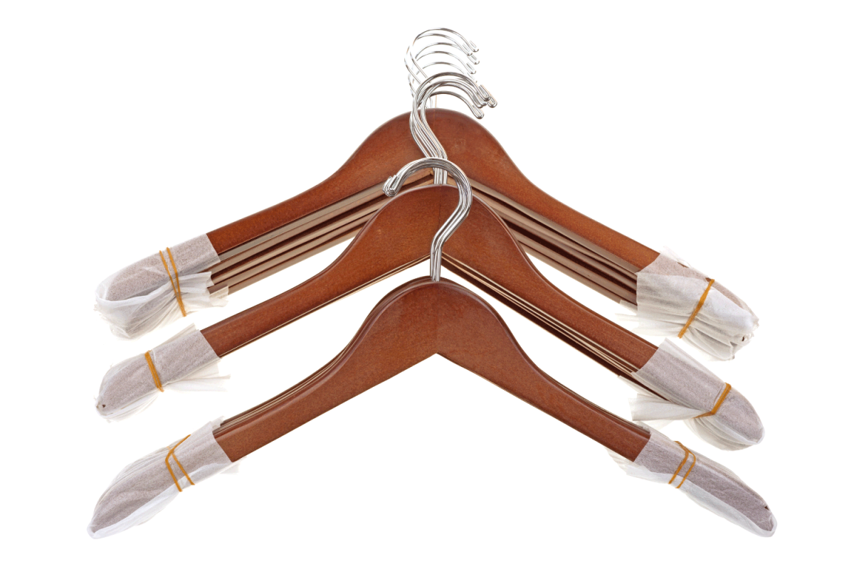 Three groups of new coat hangers with foam and rubber bands protecting the ends on a white background.
