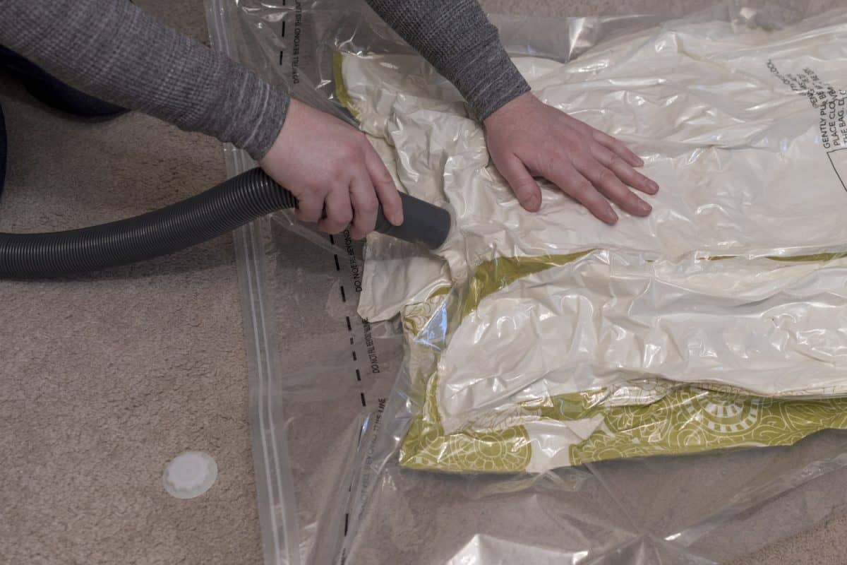 Using a vacuum storage bag to remove air from duvet

