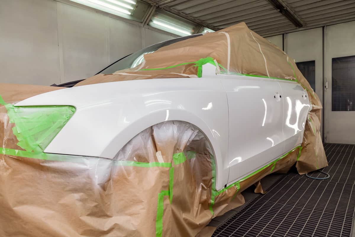 body repair is partially covered with paper and pasted over with green masking tape