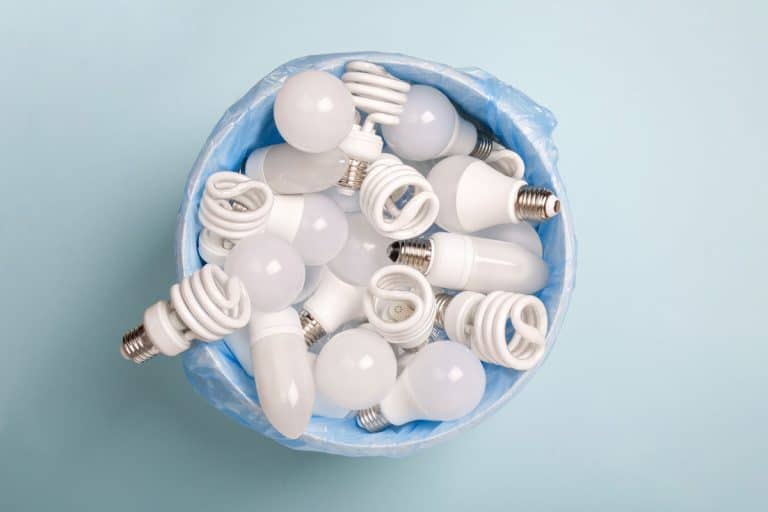 energy saving light bulbs in a bucket in disposable plastic garbage bag, How To Store Light Bulbs