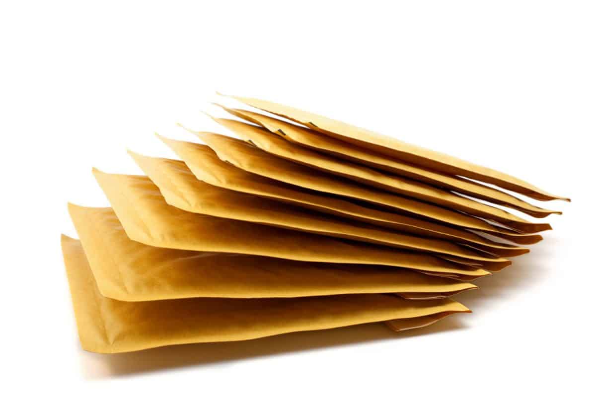 pile of brown padded envelope on white background

