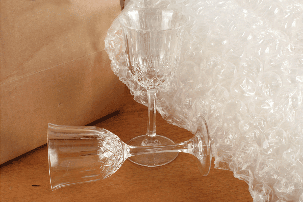 stemware being readied for moving, bubble and paper wrap at the back. How To Pack Crystal And Stemware For Moving
