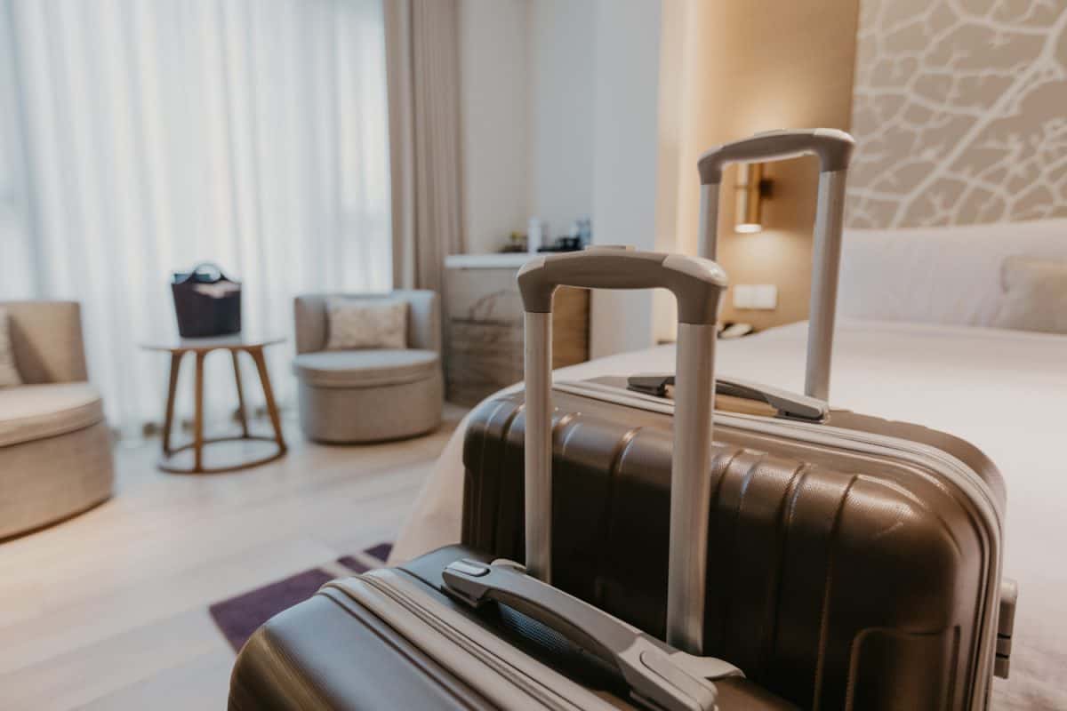 suitcases in light hotel room - Image

