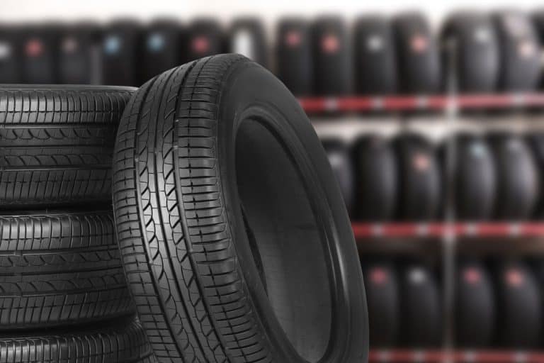 Black car tires in storage, closeup, How Long Do Tires Last In Storage