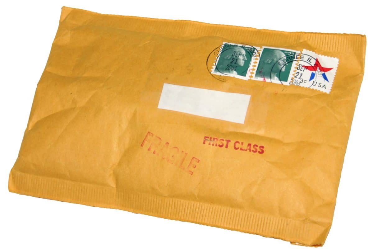 Envelope with US postmarked stamps, blanked out address label