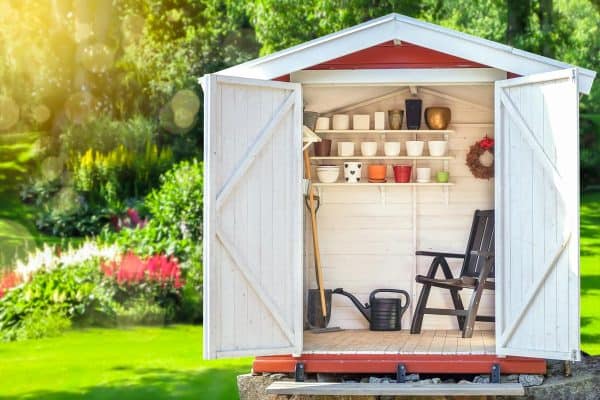 A garden shed filled with gardening tools, How to Ship A Storage Shed