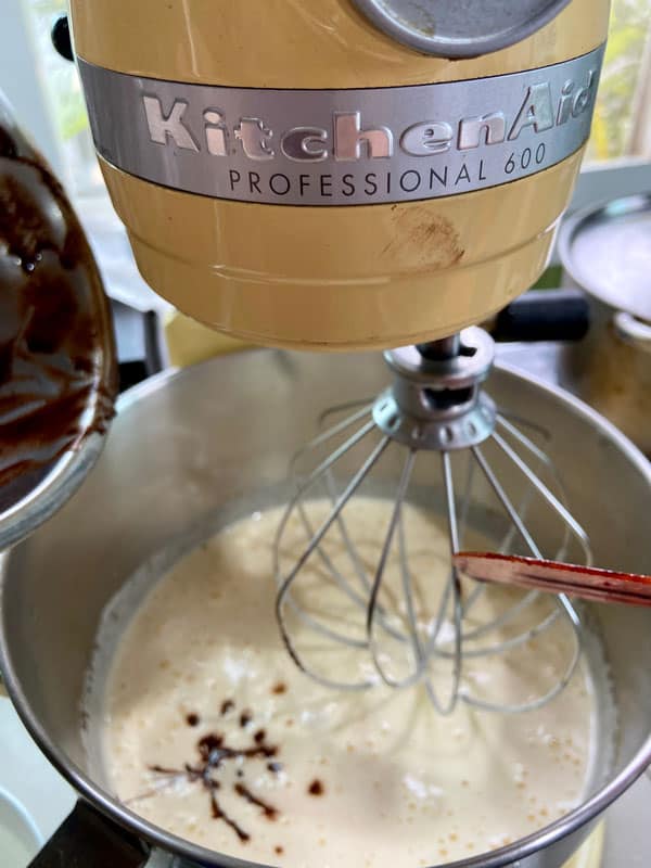 Kitchen Aid Brand on cake ingredients mixer in home kitchen with mixture of cake