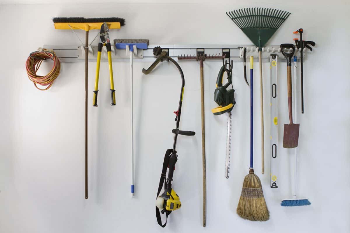 Neat garage tools hanging on a storage rack


