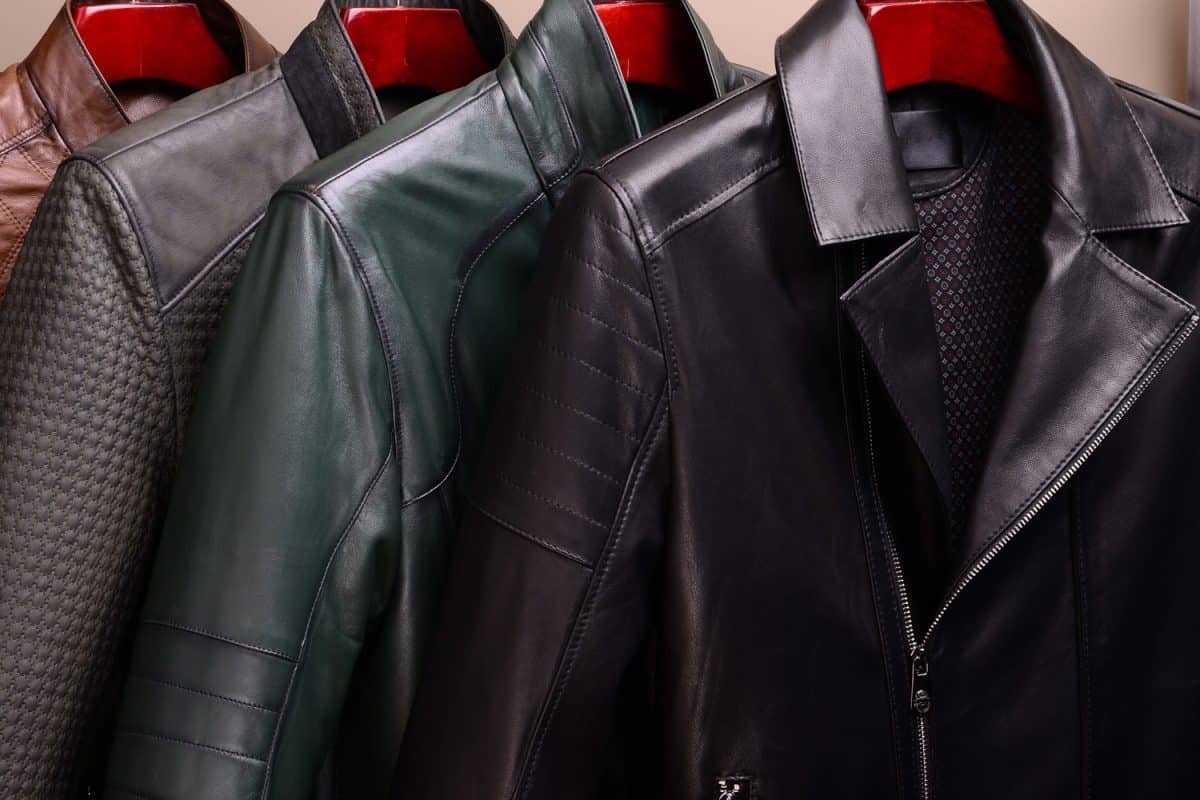 New collection of different color spring leather jackets for men. Colorful background of modern spring, autumn outerwear.