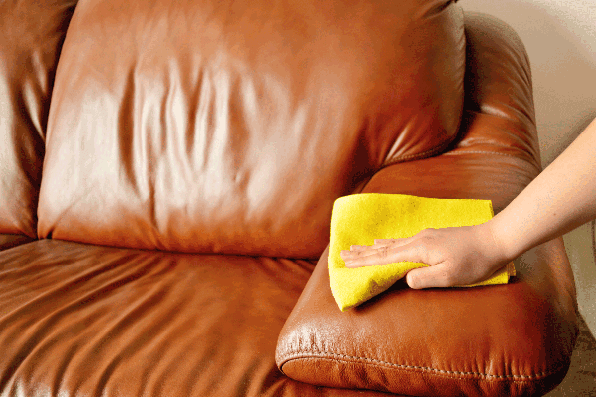 brown sofa cleaning using yellow cloth. How To Store A Leather Sofa In A Garage